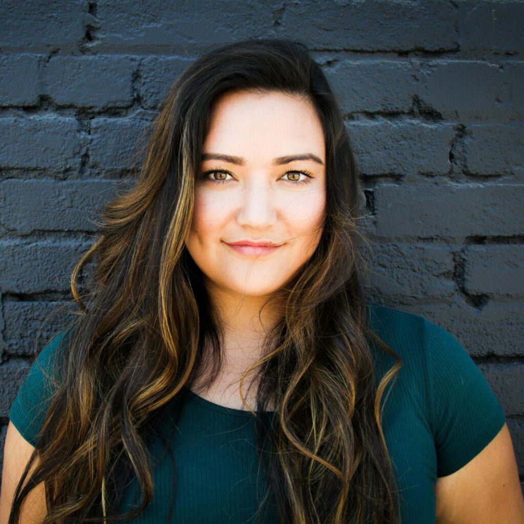 Close-Up Photography of a Woman Near Wall